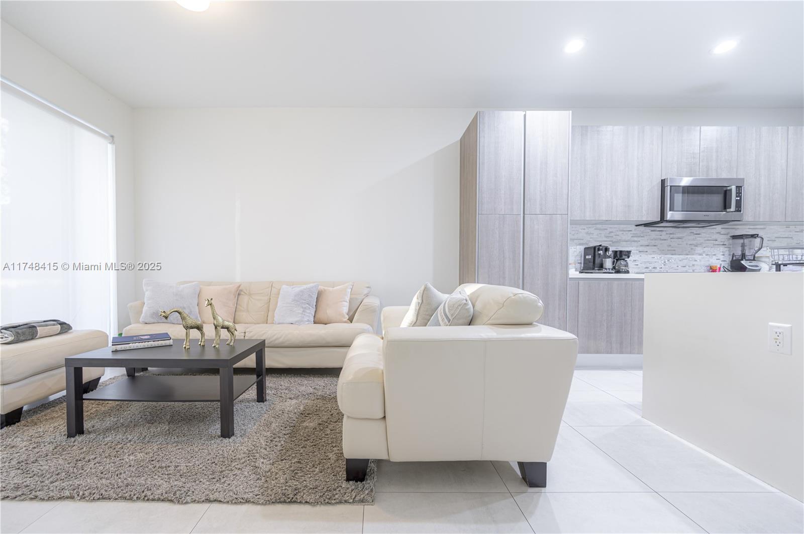 7250 Northwest 103rd Path Doral, FL 33178 - Photo 16 of 28 a living room with furniture and a couch