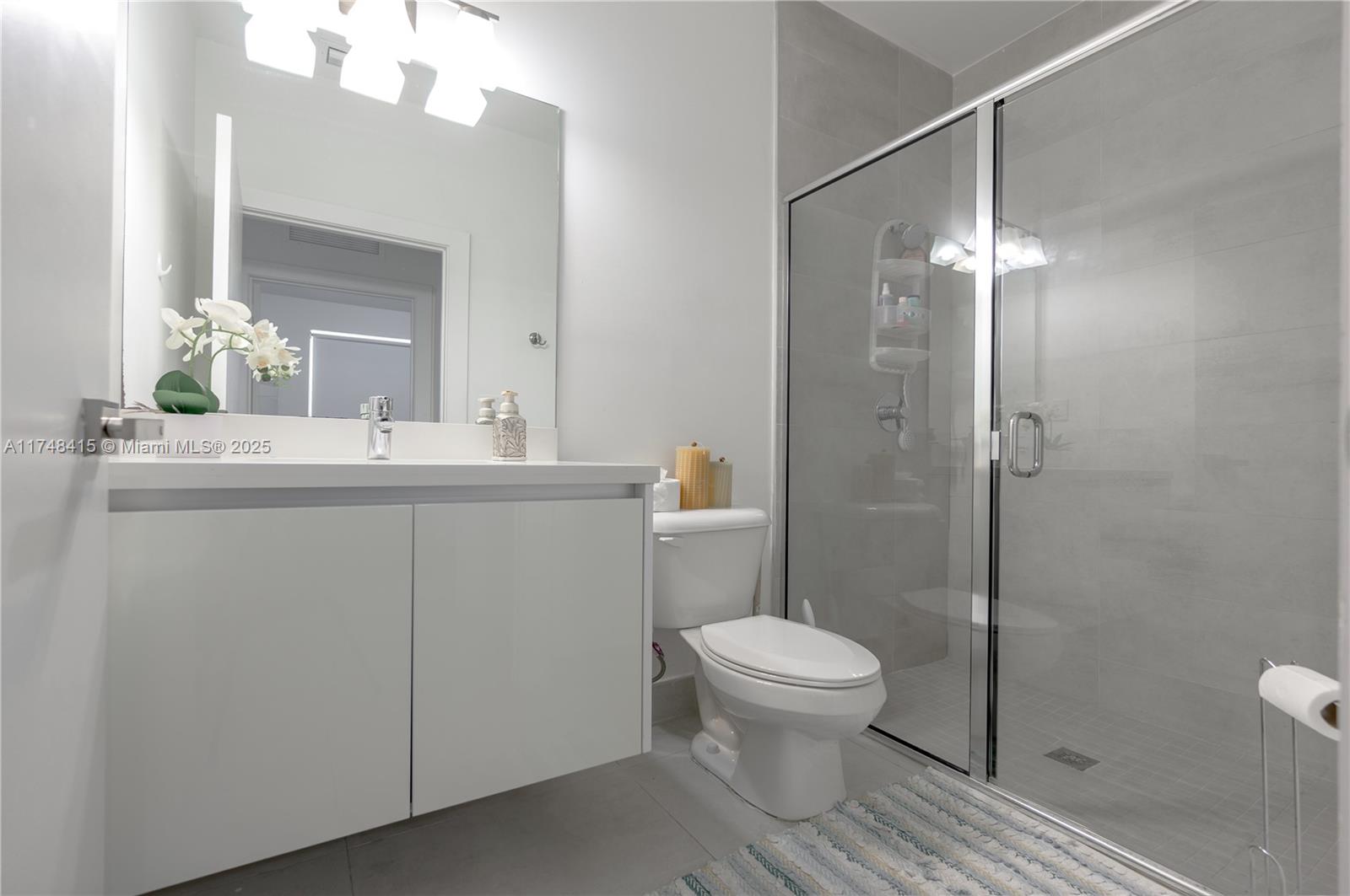 7250 Northwest 103rd Path Doral, FL 33178 - Photo 17 of 28 a bathroom with a sink toilet and shower