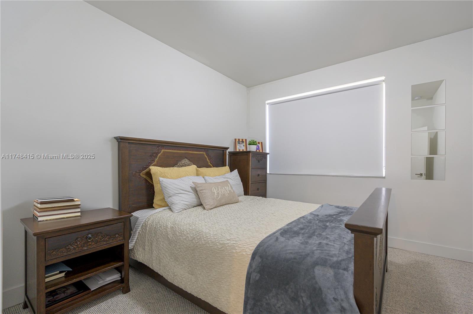 7250 Northwest 103rd Path Doral, FL 33178 - Photo 18 of 28 a bedroom with a bed and a window