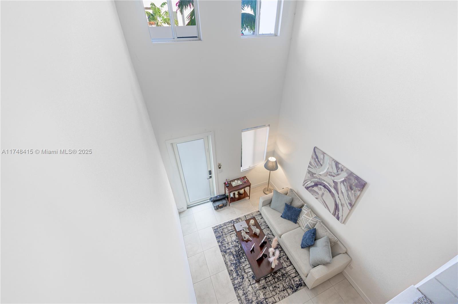 7250 Northwest 103rd Path Doral, FL 33178 - Photo 25 of 28 a view of utility room with window and wooden floor