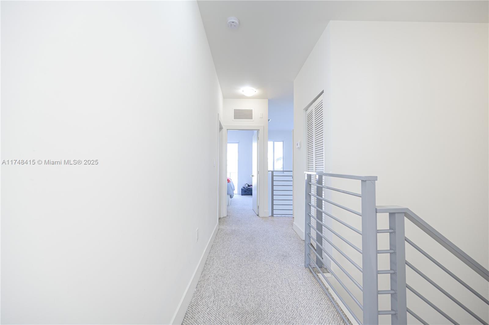 7250 Northwest 103rd Path Doral, FL 33178 - Photo 27 of 28 a view of a hallway with wooden floor