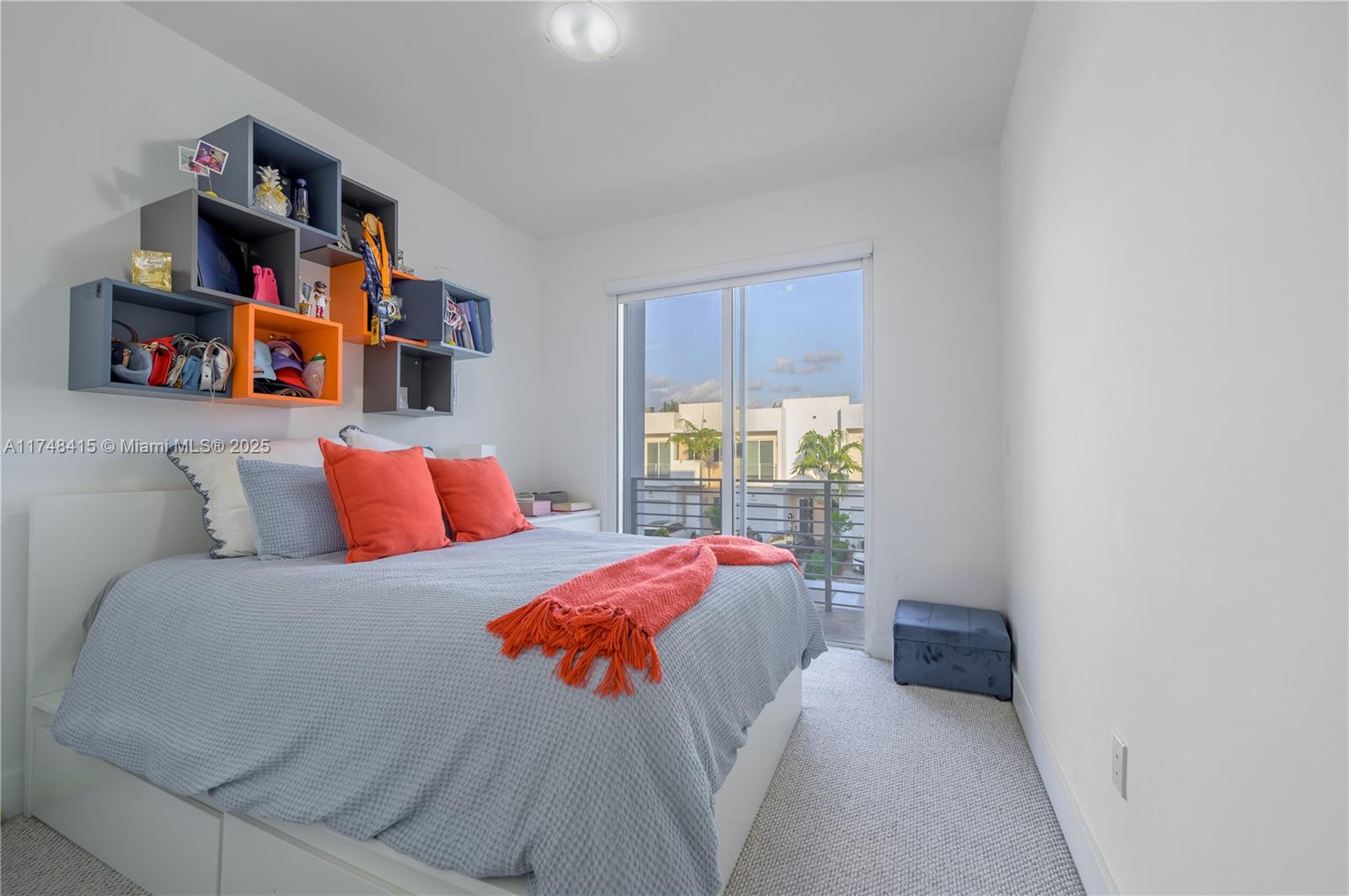 7250 Northwest 103rd Path Doral, FL 33178 - Photo 28 of 28 a bedroom with a bed and a book shelf