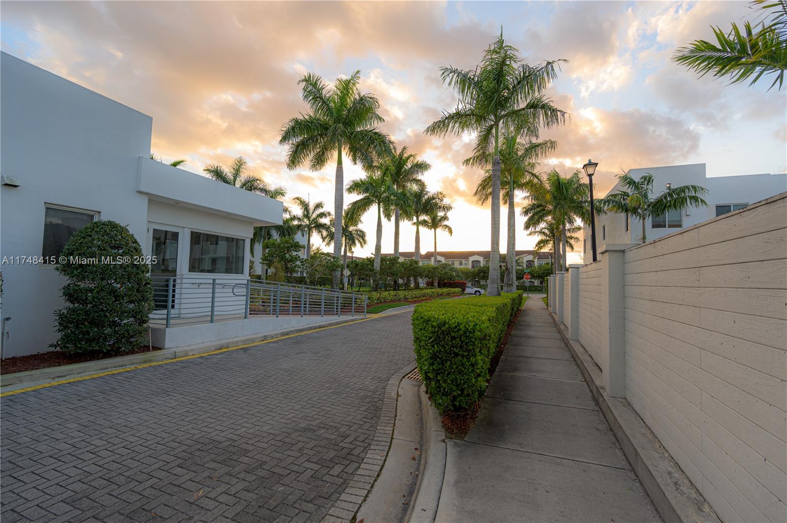 7250 Northwest 103rd Path Doral, FL 33178 - Photo 4 of 28 a view of a house with a yard and potted plants