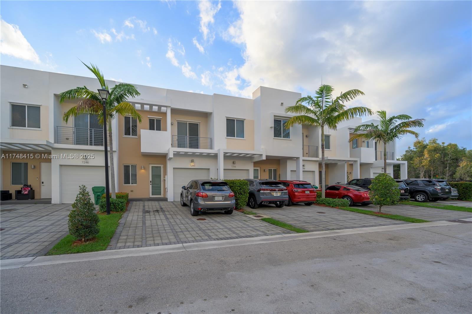 7250 Northwest 103rd Path Doral, FL 33178 - Photo 6 of 28 a front view of a house with garden
