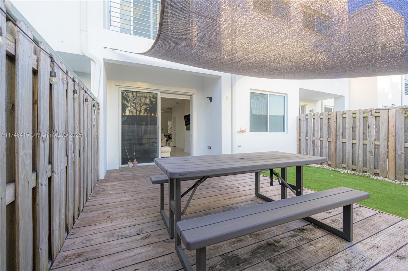 7250 Northwest 103rd Path Doral, FL 33178 - Photo 10 of 28 a house view with a wooden seating space