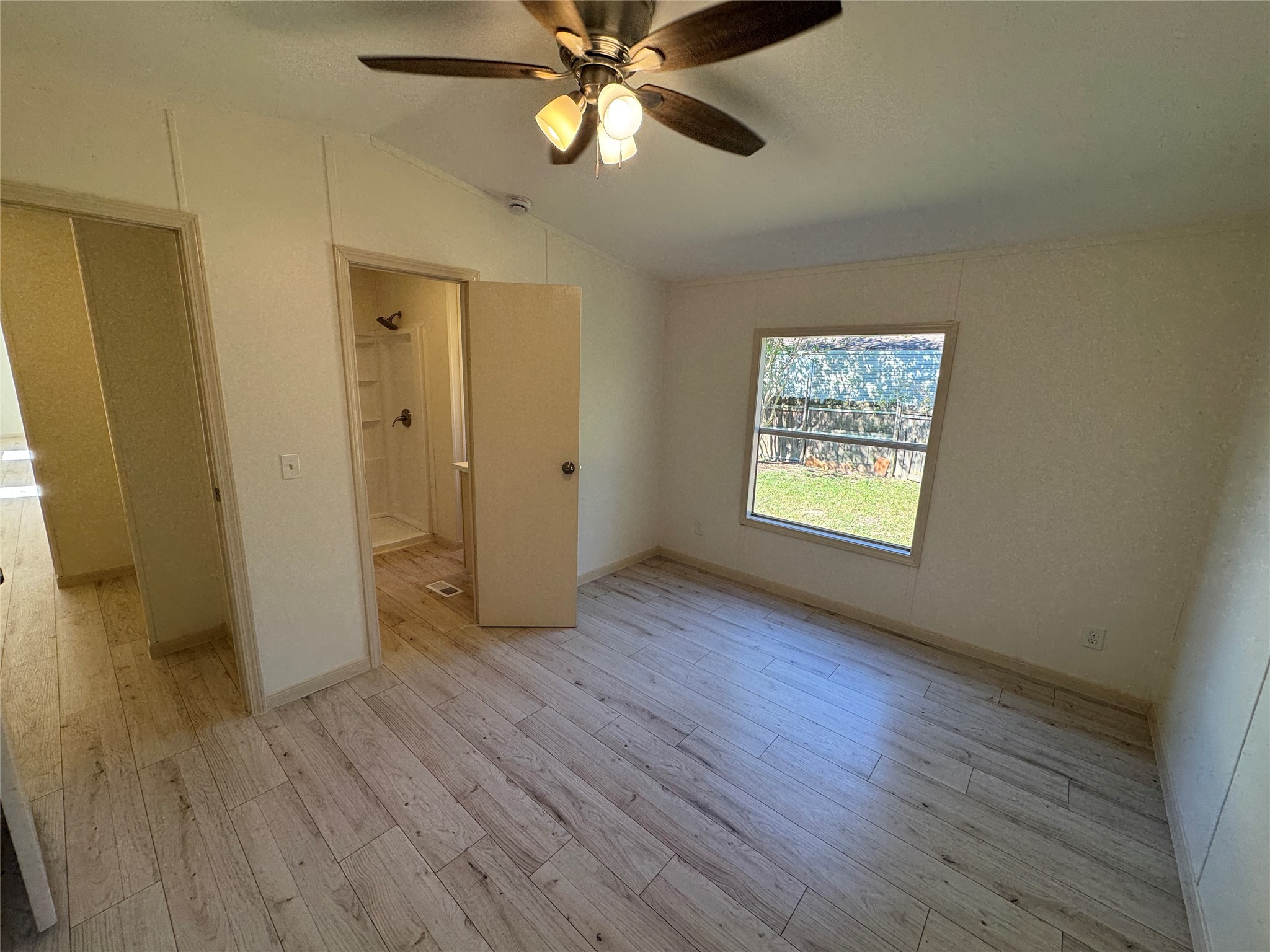 31306 East Timberloch Trail Magnolia, TX 77355 - Photo 6 of 18 a view of an empty room with window and wooden floor