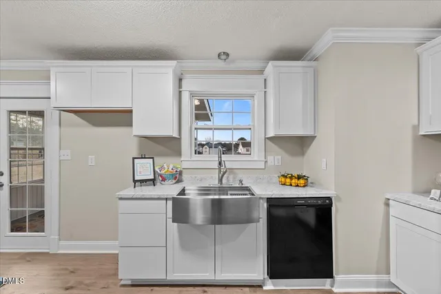 a kitchen with a sink and cabinets