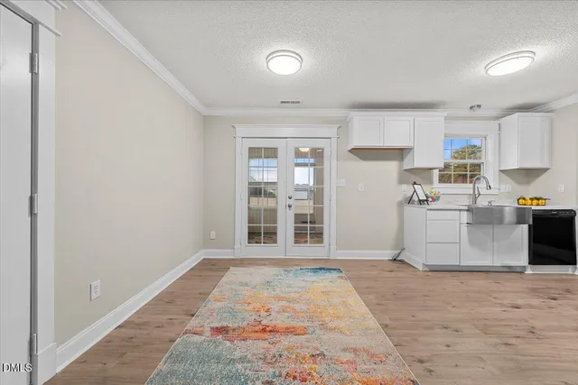 a view of a kitchen with microwave and cabinets
