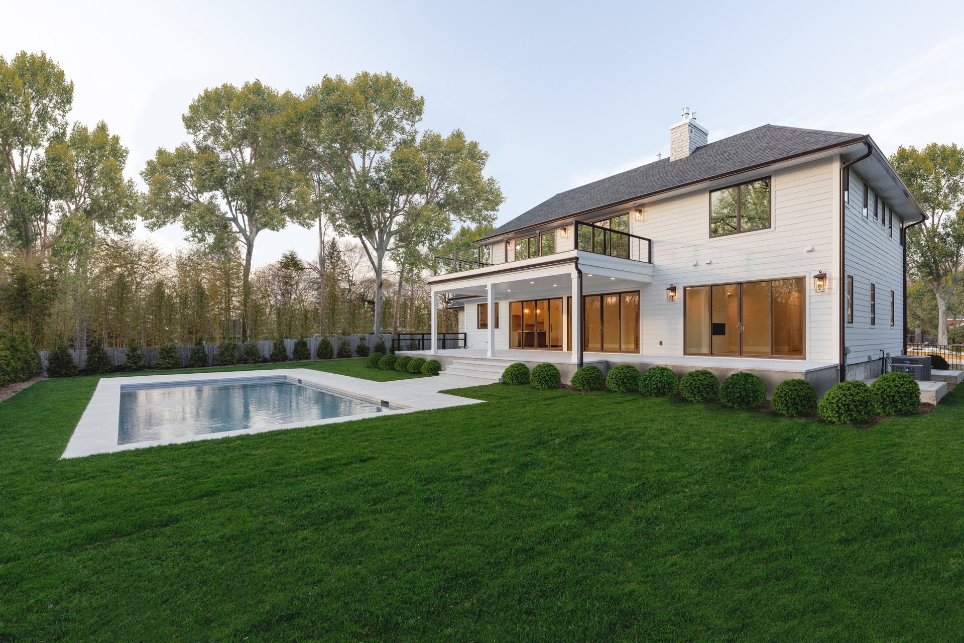26 Pine Tree Road Southampton, NY 11968 - Photo 25 of 25 Rear view of property featuring a balcony, a chimney, central air condition unit, and a patio