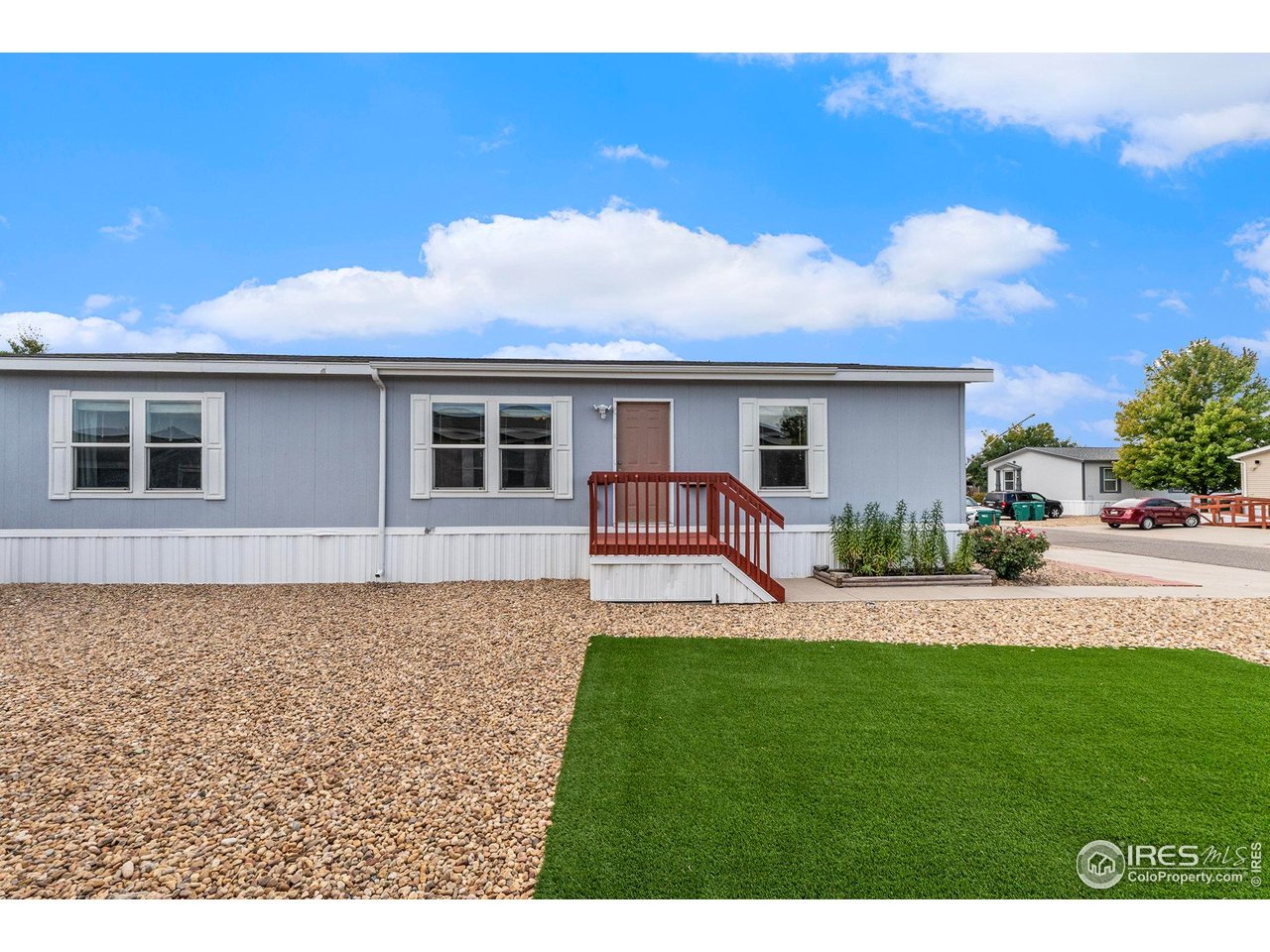 10684 Aspen Street, Unit 72 Firestone, CO 80504 - Photo 1 of 21 a house view with a garden space