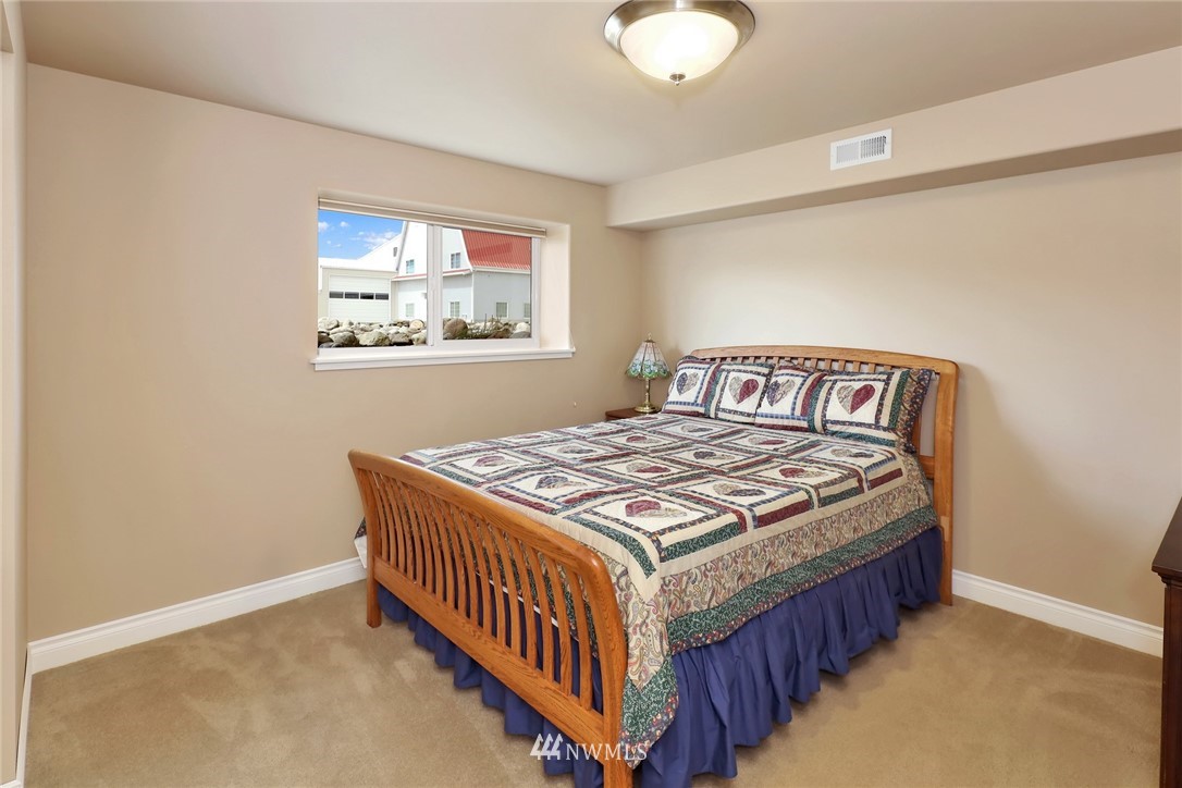 1468 East Smith Road Bellingham, WA 98226 - Photo 22 of 40 a bedroom with a bed and window