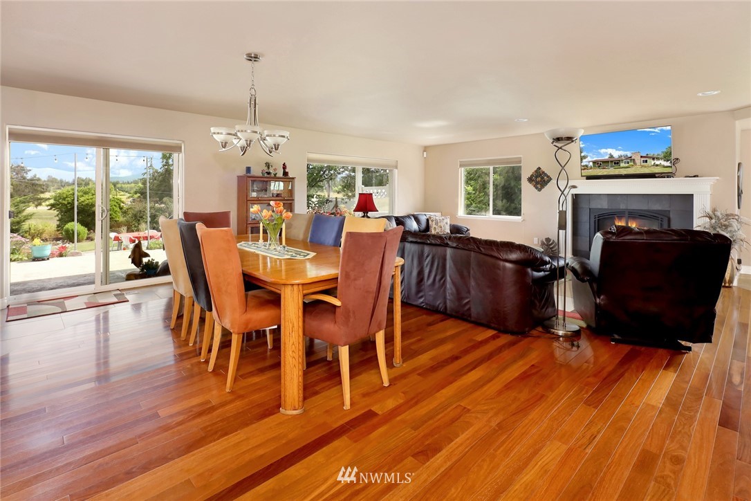 1468 East Smith Road Bellingham, WA 98226 - Photo 4 of 40 a view of a dining room with furniture window and wooden floor