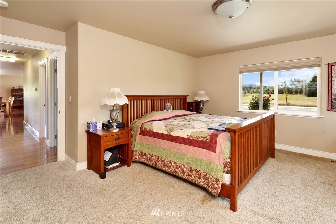 1468 East Smith Road Bellingham, WA 98226 - Photo 9 of 40 a bedroom with a bed and a large window