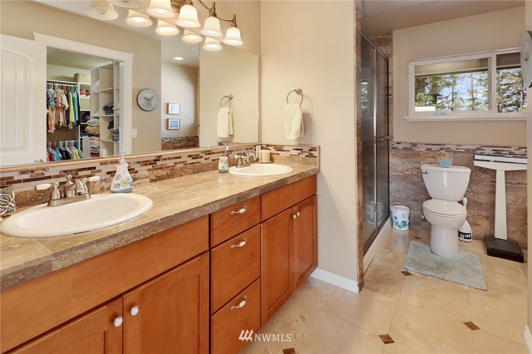 1468 East Smith Road Bellingham, WA 98226 - Photo 10 of 40 a bathroom with a sink a toilet and a mirror