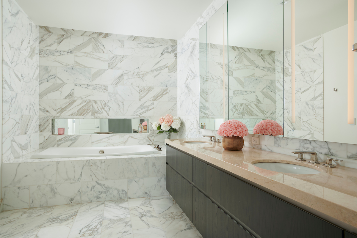 363 East Wacker Drive, Unit 3009 Chicago, IL 60601 - Photo 14 of 38 a bathroom with a granite countertop bathtub sink vanity and mirror