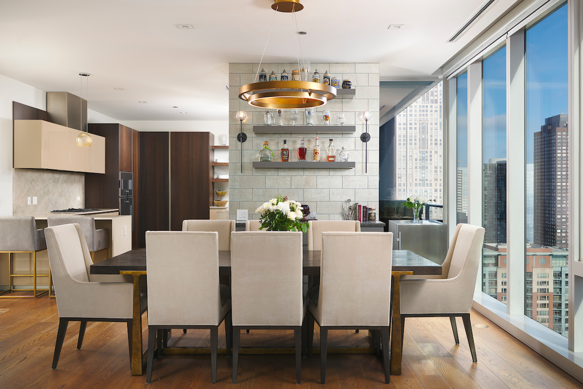 363 East Wacker Drive, Unit 3009 Chicago, IL 60601 - Photo 5 of 38 a view of a dining room with furniture and wooden floor