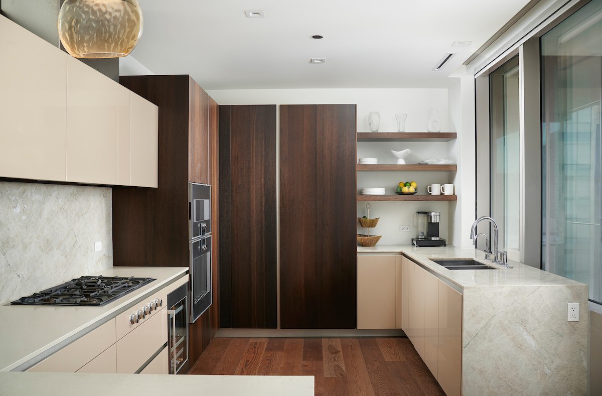 363 East Wacker Drive, Unit 3009 Chicago, IL 60601 - Photo 8 of 38 a kitchen with a stove and a refrigerator