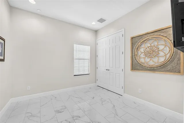 a bathroom with a bathtub shower sink mirror and toilet