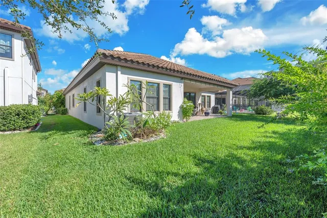an aerial view of multiple houses with yard