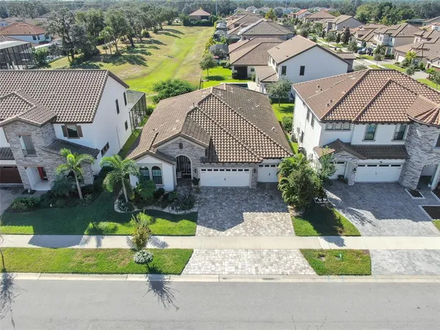 an aerial view of a house with a garden and plants