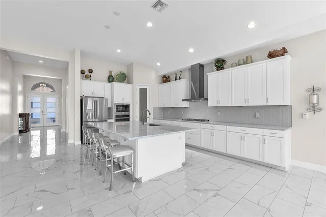 a large kitchen with cabinets
