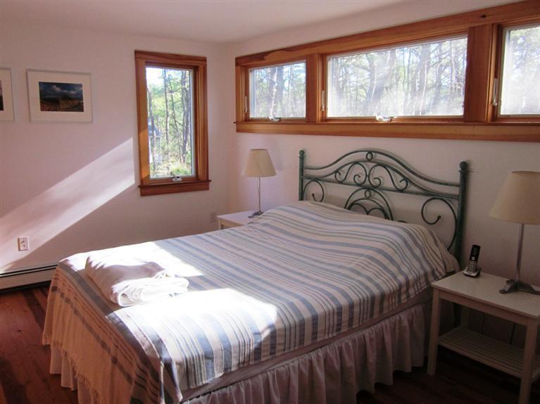 21 Tecumseh Road Wellfleet, MA 02667 - Photo 15 of 33 a bedroom with a bed and a window