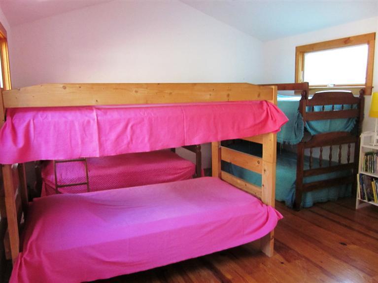 21 Tecumseh Road Wellfleet, MA 02667 - Photo 20 of 33 a bedroom with a bed and a window