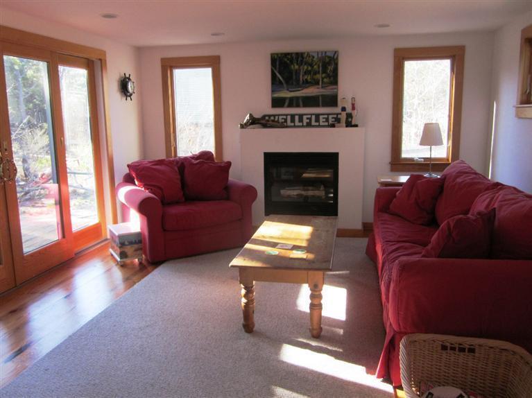 21 Tecumseh Road Wellfleet, MA 02667 - Photo 2 of 33 a living room with furniture and a fireplace