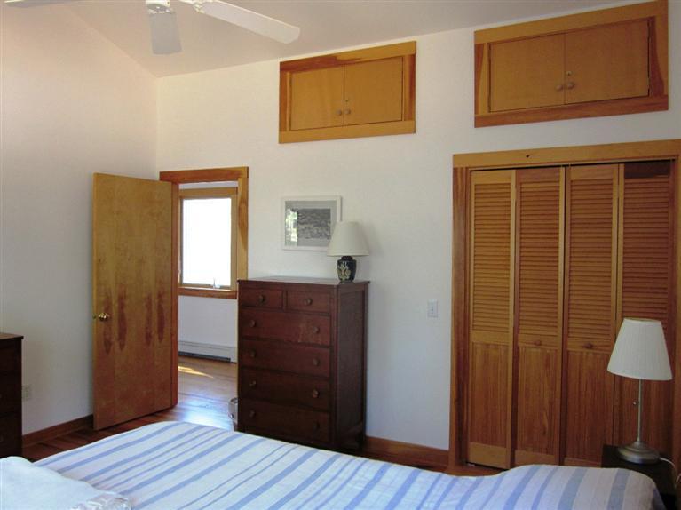 21 Tecumseh Road Wellfleet, MA 02667 - Photo 25 of 33 a room that has a wooden bed and a mirror