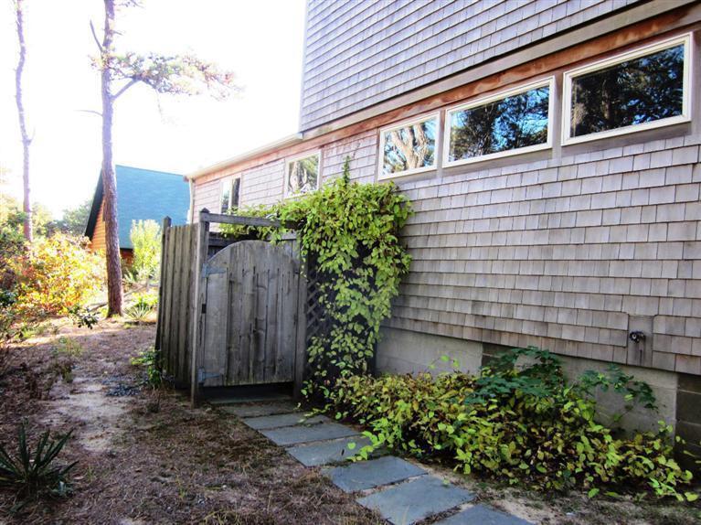 21 Tecumseh Road Wellfleet, MA 02667 - Photo 27 of 33 a potted plant sitting in front of a house