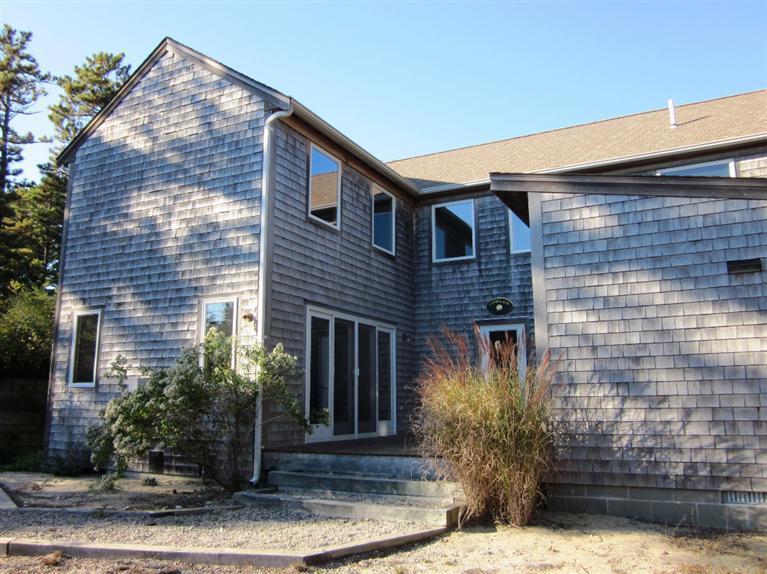 21 Tecumseh Road Wellfleet, MA 02667 - Photo 33 of 33 a front view of a house with plants