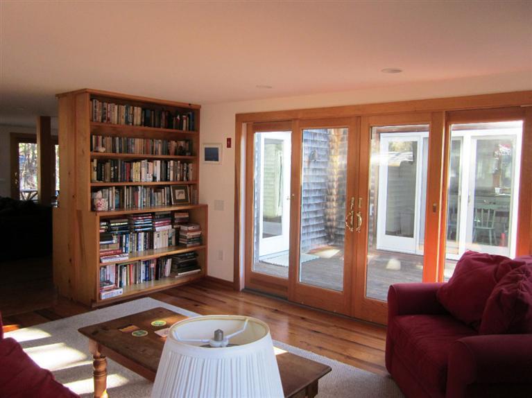 21 Tecumseh Road Wellfleet, MA 02667 - Photo 4 of 33 a living room with furniture and a book shelf