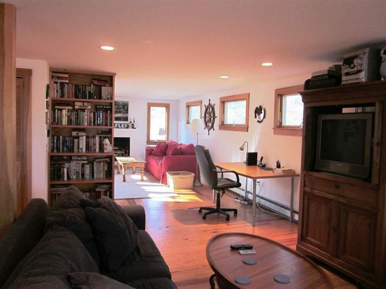 21 Tecumseh Road Wellfleet, MA 02667 - Photo 5 of 33 a living room with furniture and a flat screen tv