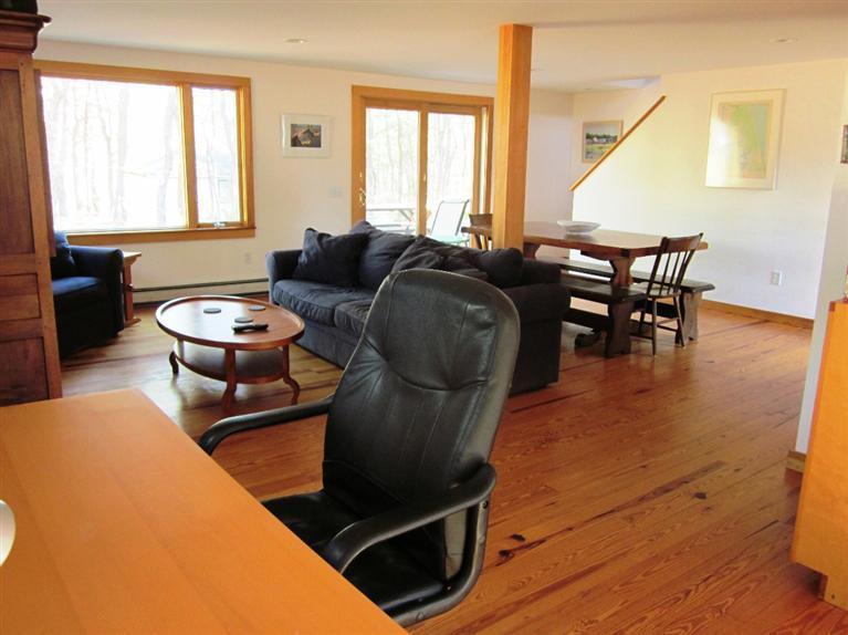 21 Tecumseh Road Wellfleet, MA 02667 - Photo 7 of 33 a living room with furniture and a large window