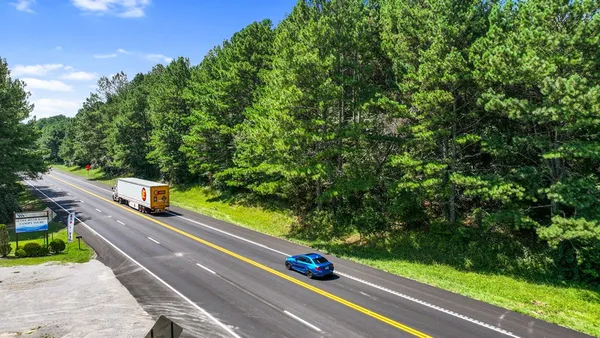 a view of a street with seating space