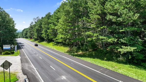 a view of a back yard from a balcony