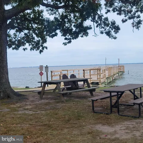 a view of a house with a yard and slide