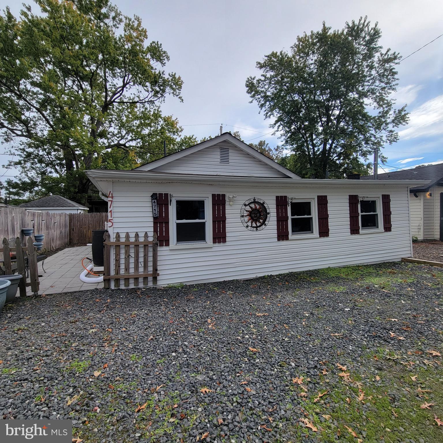 4715 Frederick Avenue Shady Side, MD 20764 - Photo 2 of 20 a front view of a house with a garden