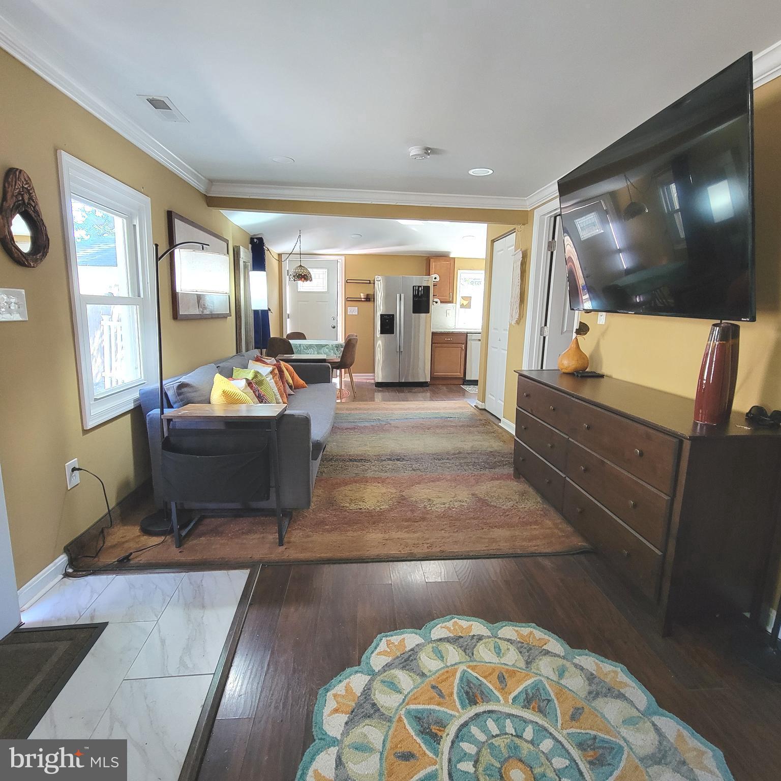 4715 Frederick Avenue Shady Side, MD 20764 - Photo 20 of 20 a living room with couch and a flat screen tv
