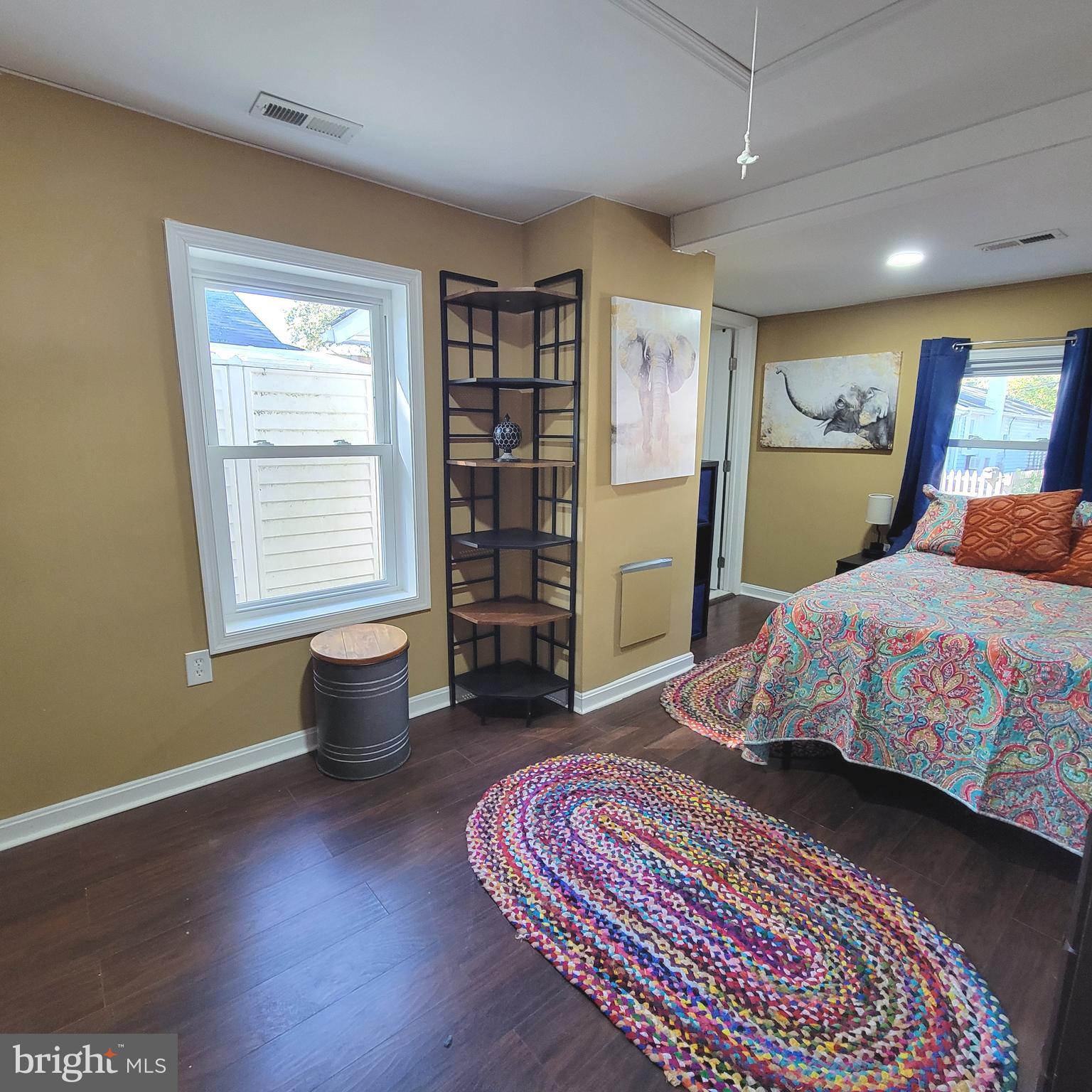 4715 Frederick Avenue Shady Side, MD 20764 - Photo 5 of 20 a bedroom with a large bed and a window