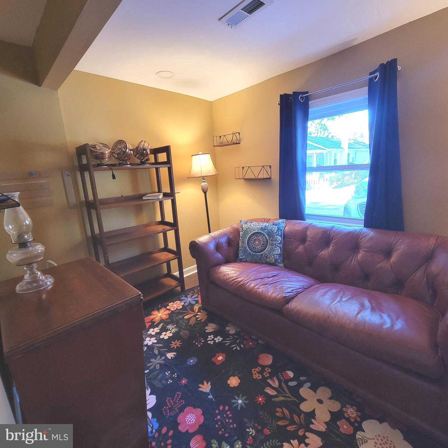 4715 Frederick Avenue Shady Side, MD 20764 - Photo 8 of 20 a living room with furniture and a window