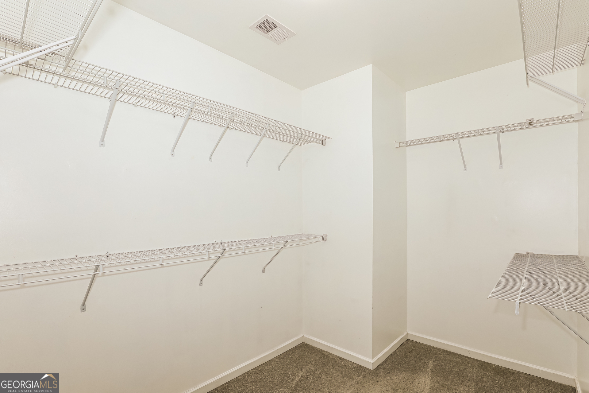 3216 Alhambra Circle Hampton, GA 30228 - Photo 14 of 21 a view of small space with empty racks