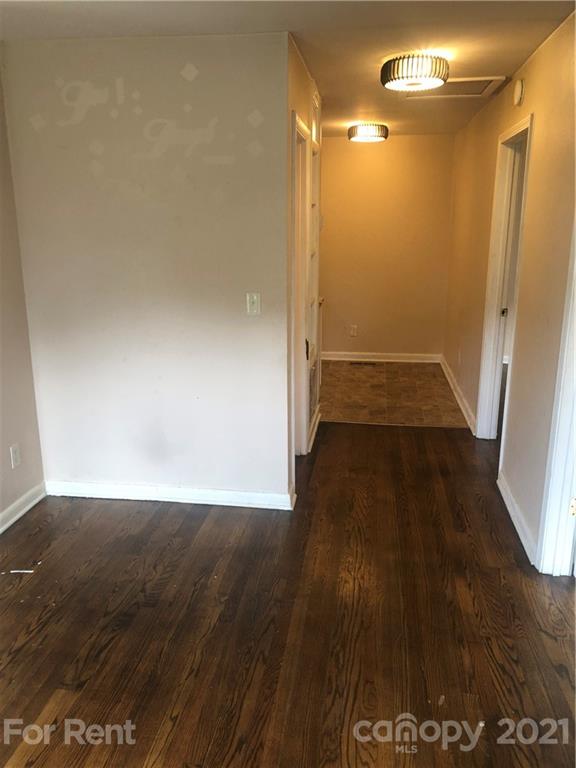1020 Rodey Avenue, Unit A Charlotte, NC 28206 - Photo 7 of 8 a view of a hallway with wooden floor