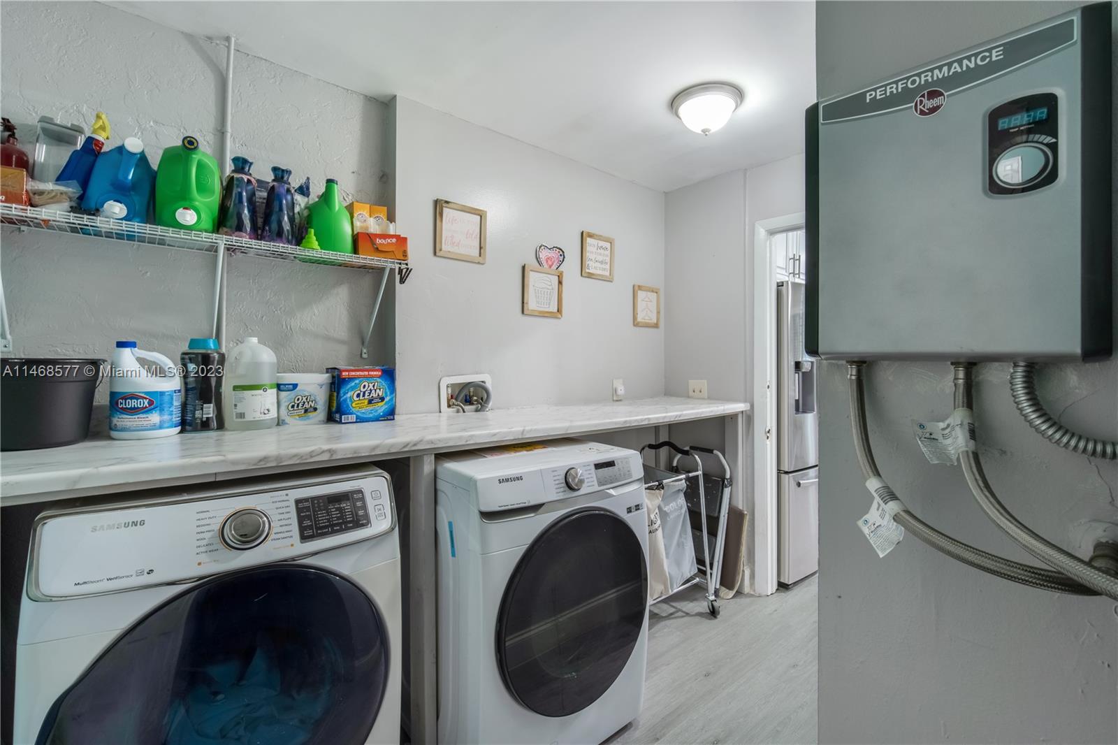 5232 Gate Lake Road, Unit 5232 Tamarac, FL 33319 - Photo 14 of 37 a utility room with dryer and washer