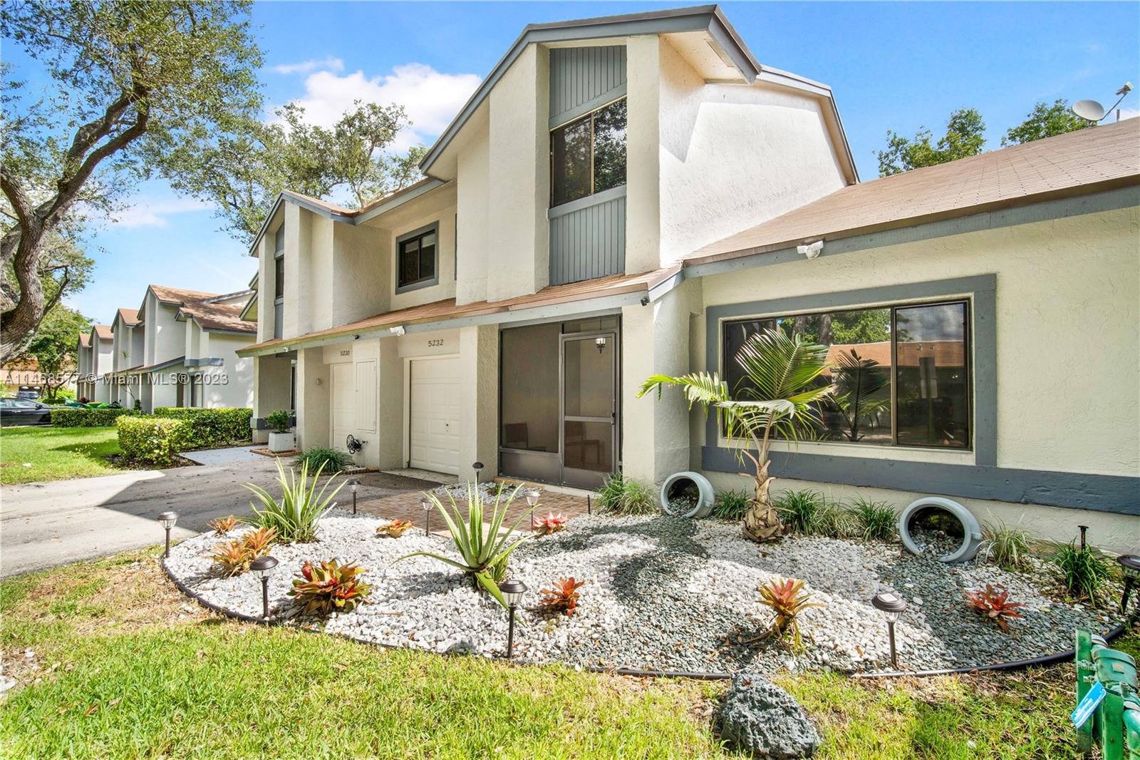 5232 Gate Lake Road, Unit 5232 Tamarac, FL 33319 - Photo 2 of 37 a front view of a house with a bath tub