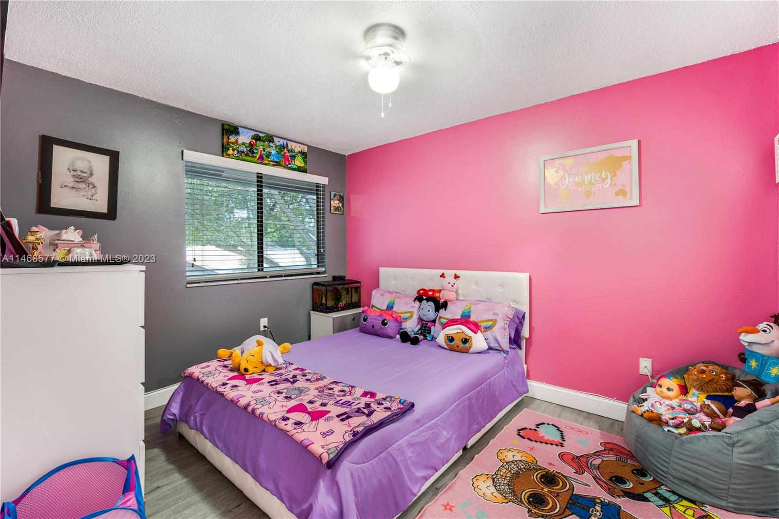 5232 Gate Lake Road, Unit 5232 Tamarac, FL 33319 - Photo 21 of 37 a bedroom with bed and a window
