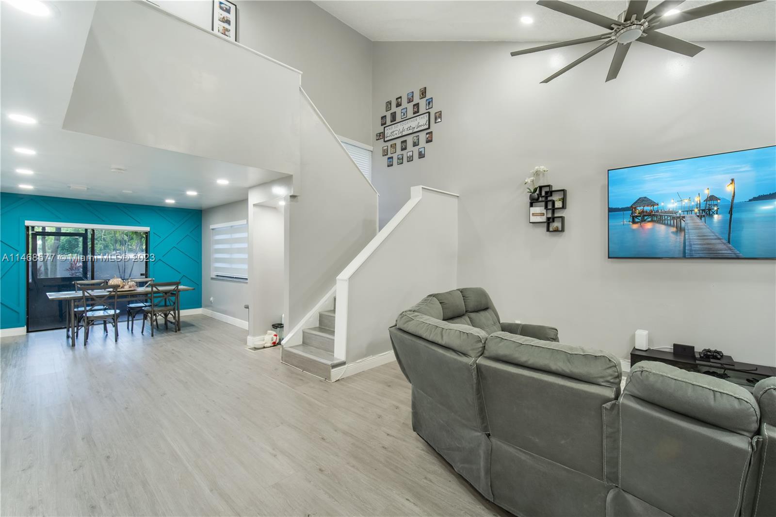 5232 Gate Lake Road, Unit 5232 Tamarac, FL 33319 - Photo 3 of 37 a living room with furniture and a wooden floor