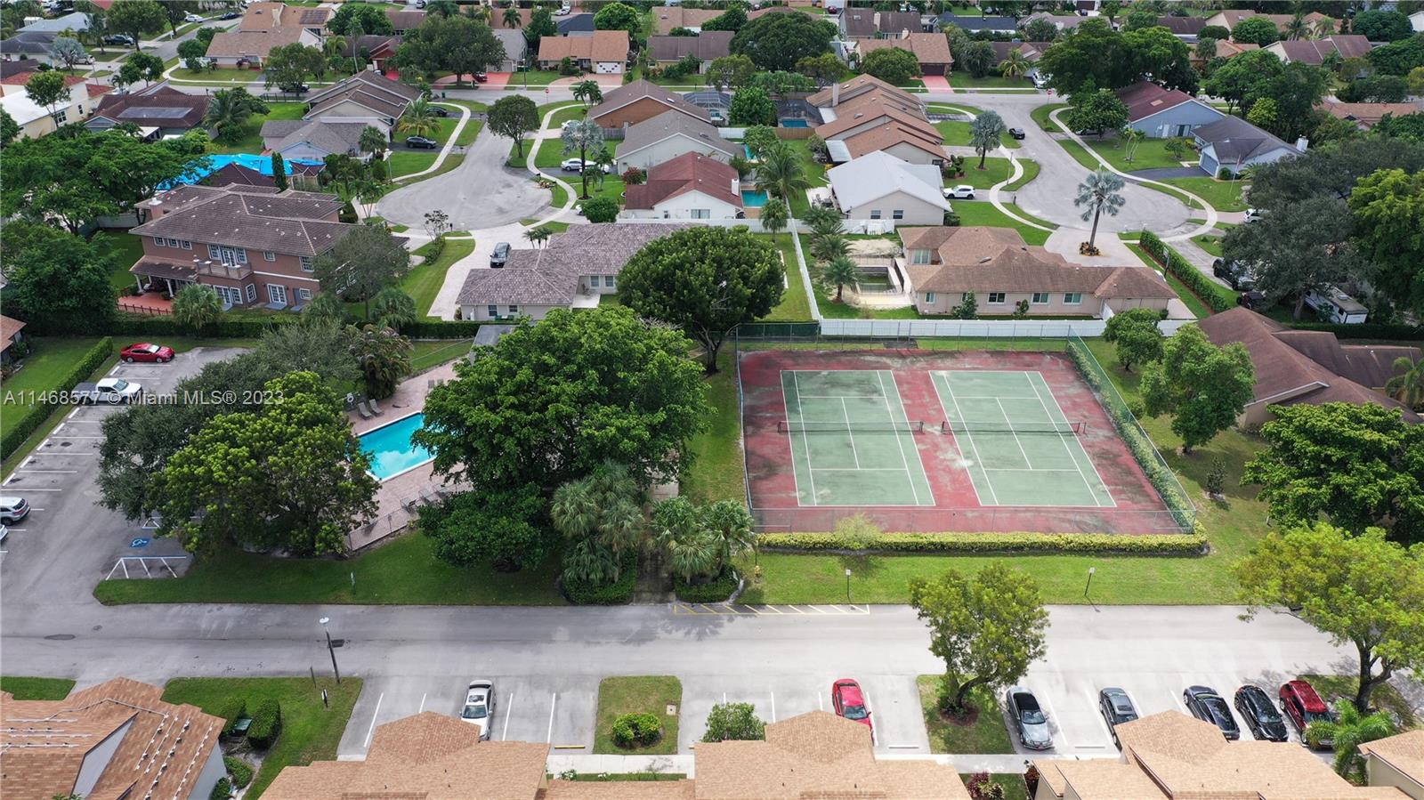 5232 Gate Lake Road, Unit 5232 Tamarac, FL 33319 - Photo 31 of 37 an aerial view of multiple houses with yard