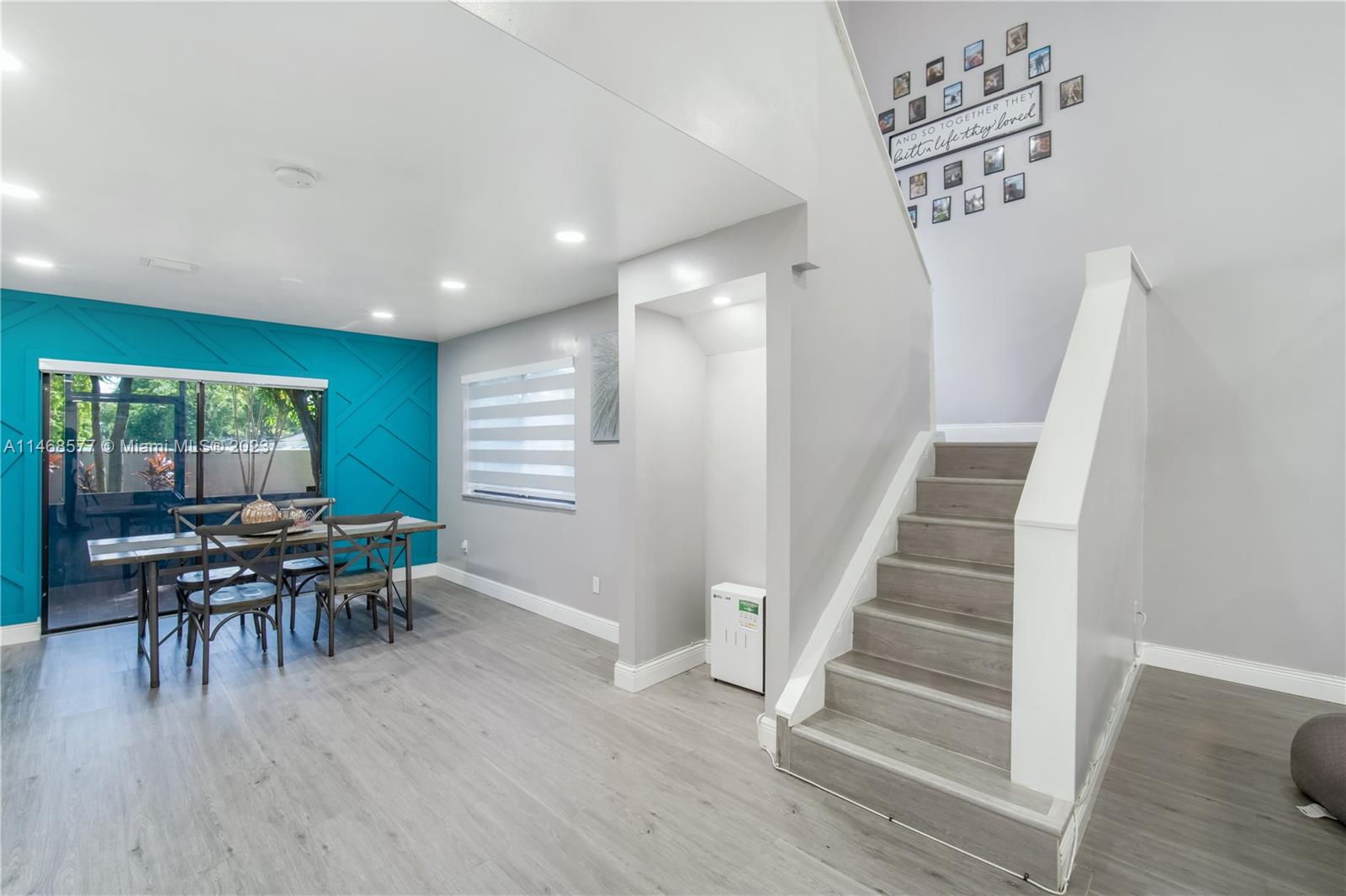 5232 Gate Lake Road, Unit 5232 Tamarac, FL 33319 - Photo 6 of 37 a view of a livingroom with furniture and wooden floor