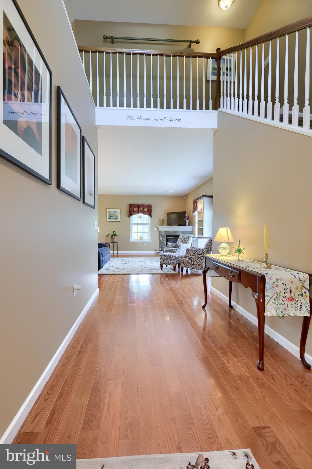 520 Providence Court Lititz, PA 17543 - Photo 19 of 44 a view of a hallway with wooden floor and couches